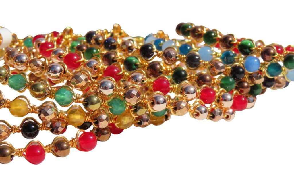 A selection of genuine gemstone and wirework stacking bracelets in silver and gold tone copper wire.  Designed and crafted by Fiona of Fifi and the Peacock.  Part of the Daily Edit Collection