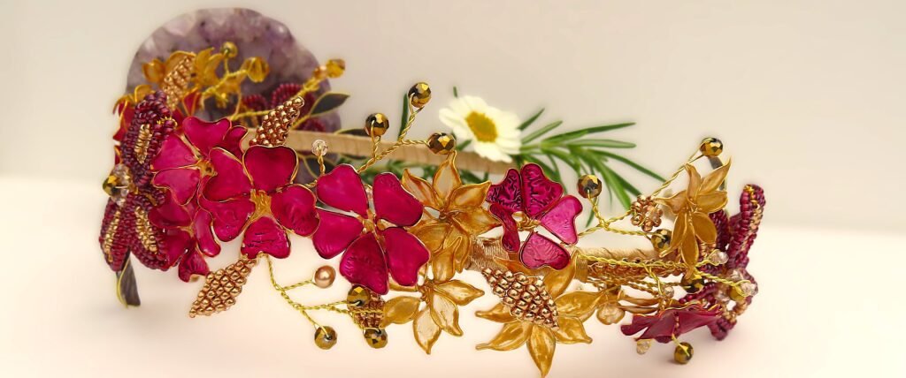 Prom headpiece featuring unique wirework flowers painted to match the colour of the prom dress with Miyuki seed beaded adornments with faceted glass crystals and gold coloured Haematite