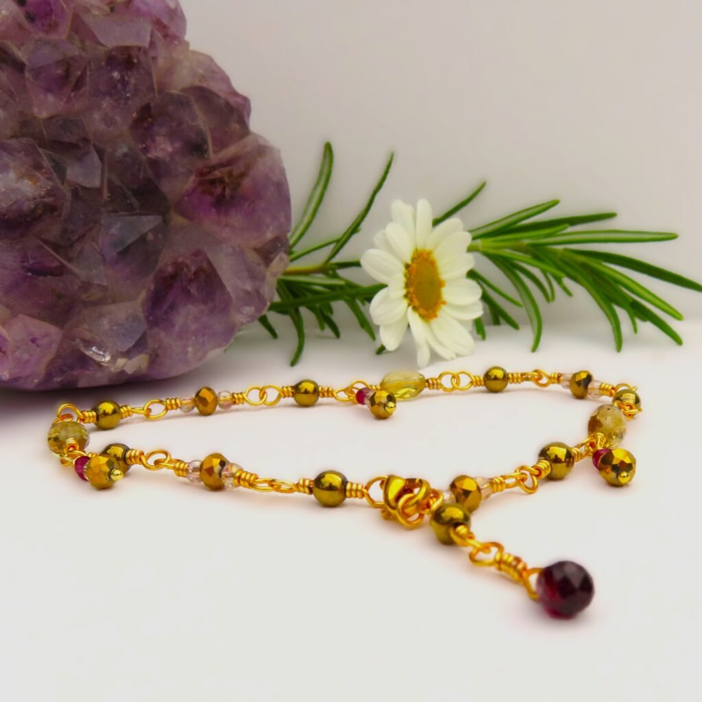 Custom made anklet to match Prom Set handcrafted by Fiona of Fifi and the Peacock.  Featuring a faceted Garnet briolette drop with faceted Champagne Quartz, micro faceted Garnet beads, gold coloured Haematite and faceted glass crystals on gilt coloured wire