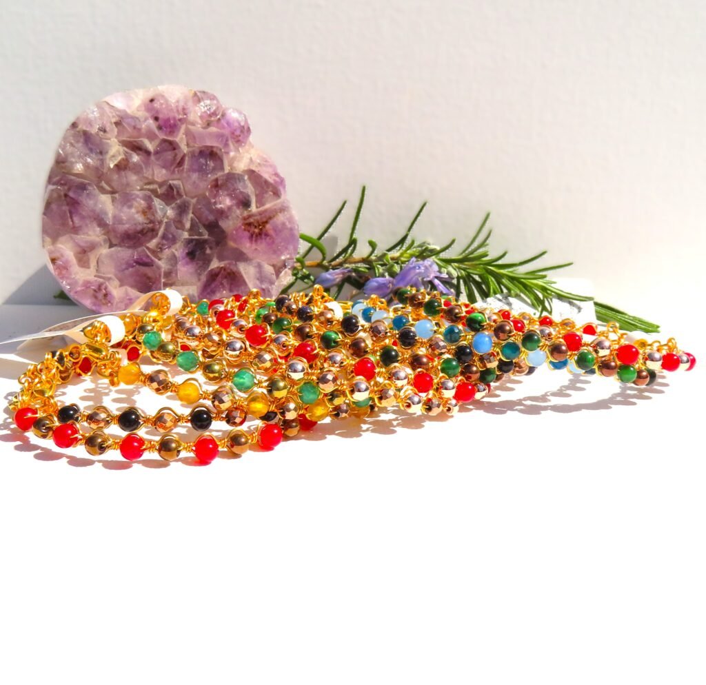 Stacking bracelets in gilt wire with genuine gemstones including dyed Jade, Haematite, Agate, Quartz in various colours.  Designed and crafted by Fiona of Fifi and the Peacock